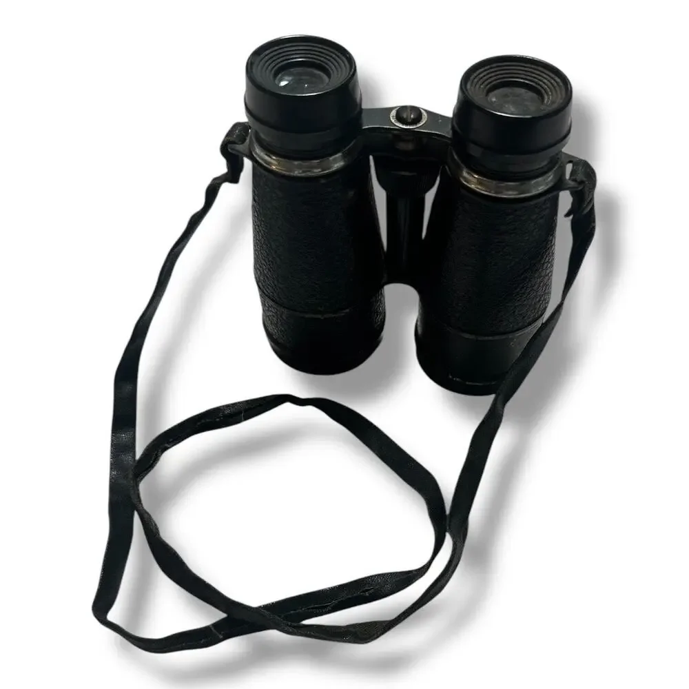 Compact Black Binoculars with Textured Grip and Central Hinge